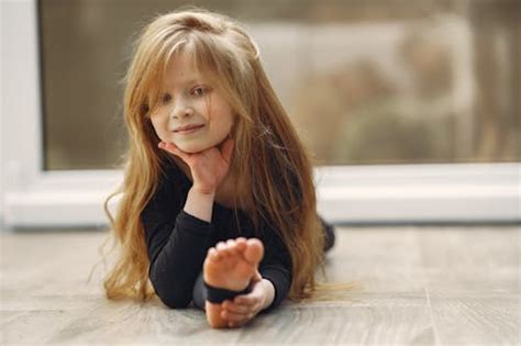 Little Girl Bending Over Free Stock Photo